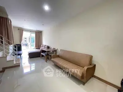 Spacious living room with modern furniture and natural light