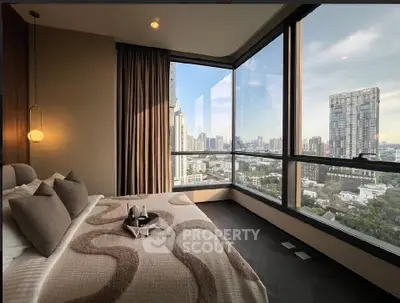 Luxurious bedroom with stunning city view and modern decor