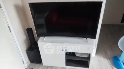Modern living room with sleek TV setup and stylish furniture