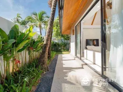 Tropical garden view with modern patio and lush greenery