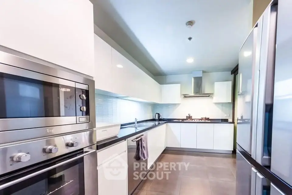 Modern kitchen with sleek appliances and ample counter space in a contemporary home.