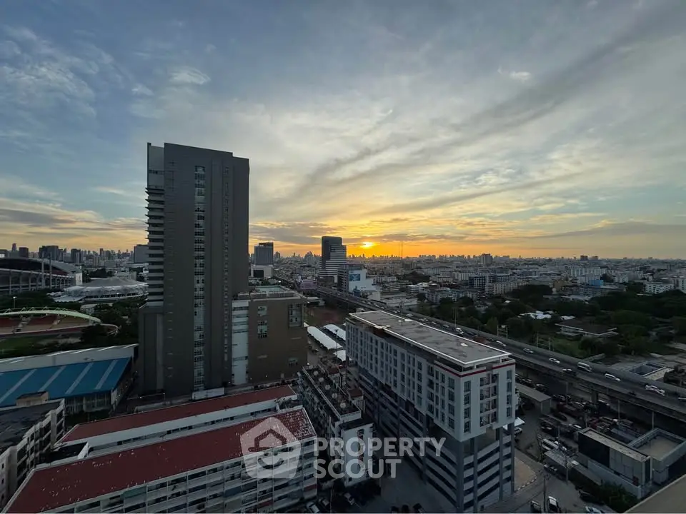 Stunning cityscape view at sunset with modern high-rise buildings and vibrant skyline.