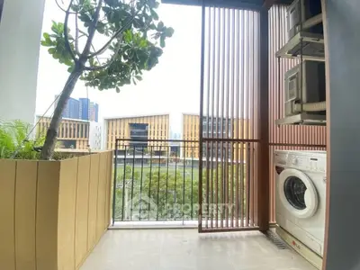 Modern balcony with washing machine and city view, perfect for urban living.