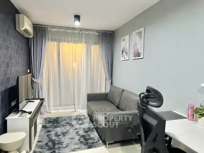 Modern living room with stylish decor, cozy sofa, and elegant curtains in a contemporary apartment.