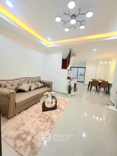 Elegant living room with modern lighting and plush seating in a stylish home interior.