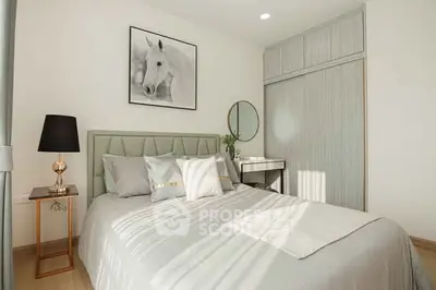 Elegant bedroom with modern decor and stylish furnishings, featuring a cozy bed and chic lighting.