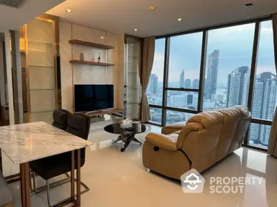 Luxurious high-rise living room with stunning city view and modern furnishings.