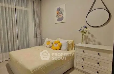 Cozy bedroom with modern decor and soft lighting, perfect for relaxation.