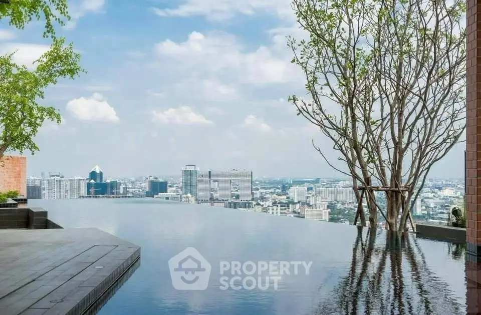 Stunning rooftop infinity pool with breathtaking city skyline view.