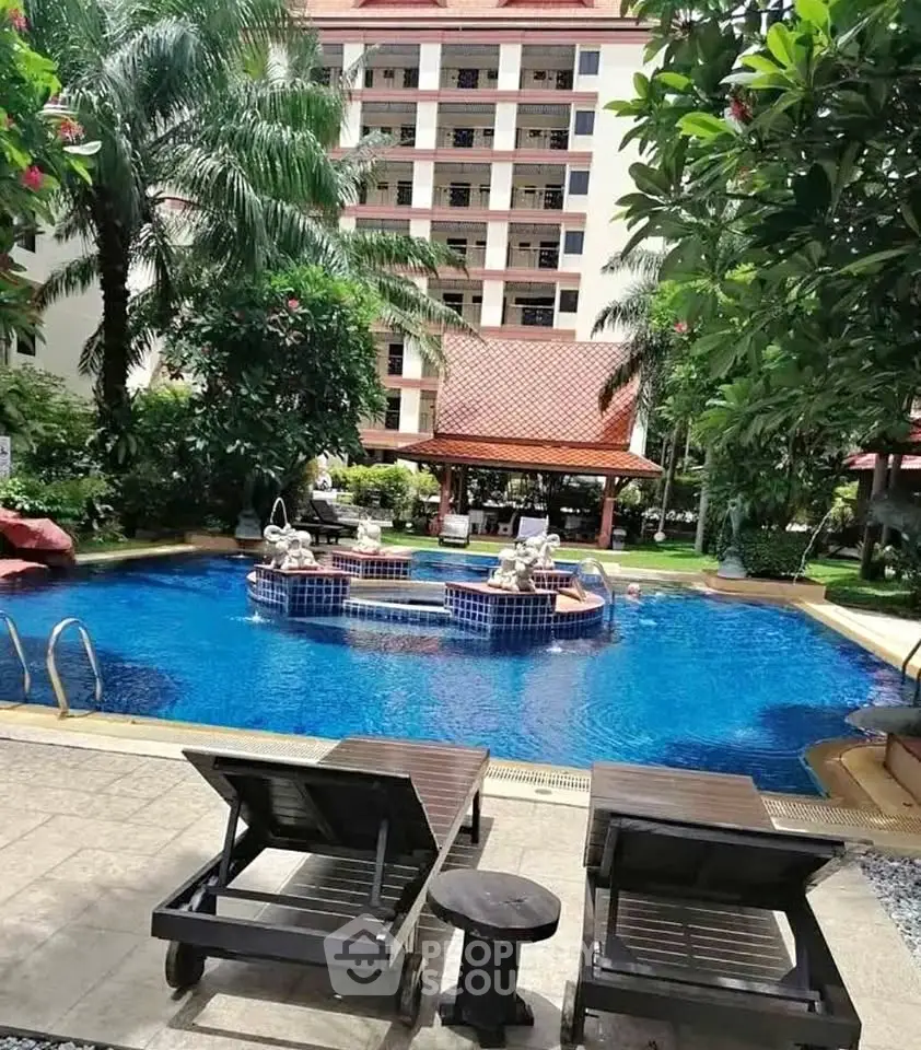 Luxurious poolside view with lush greenery and elegant architecture, perfect for relaxation and leisure.