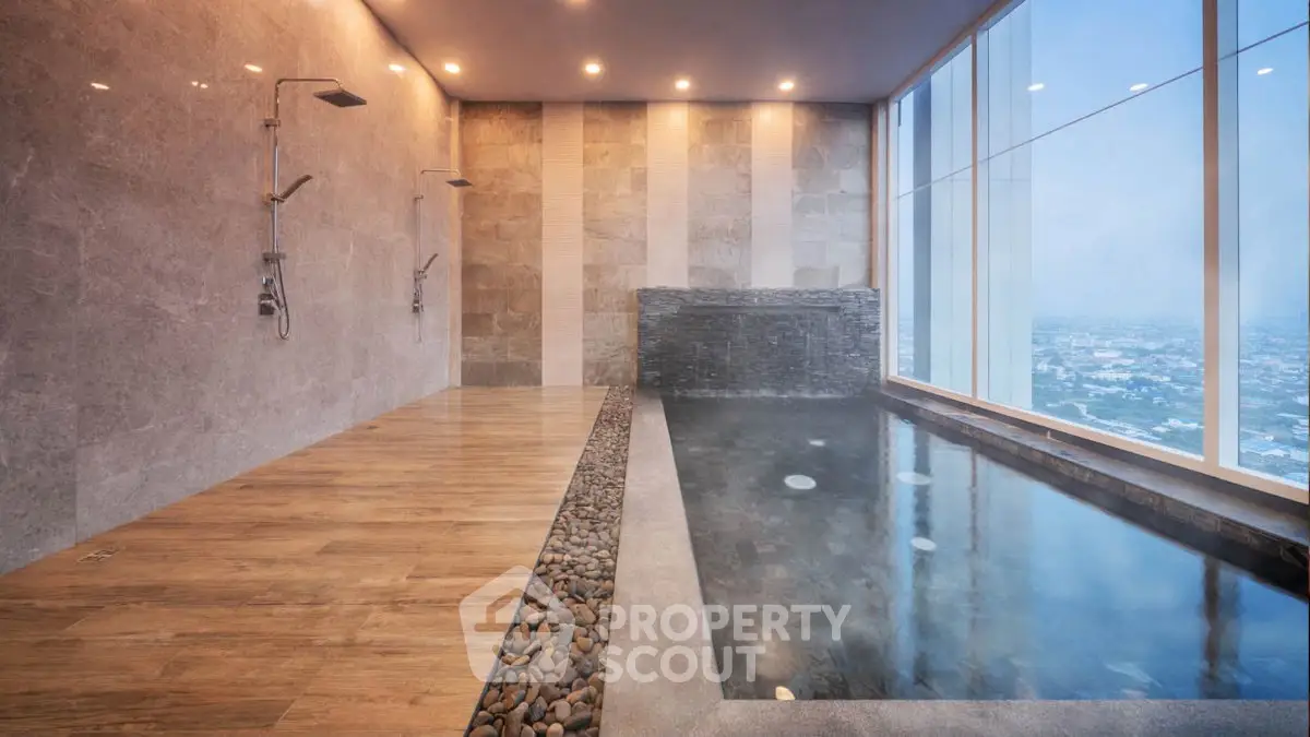 Luxurious indoor pool with stunning city view and modern design
