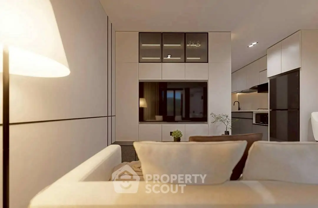 Modern living room with sleek design and integrated kitchen area