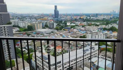 Stunning cityscape view from a high-rise balcony overlooking urban skyline and distant skyscrapers.