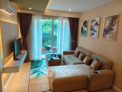 Stylish living room with modern decor and large window opening to a lush balcony view.
