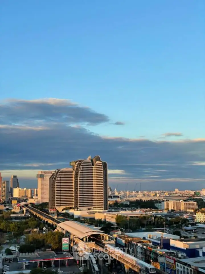 Stunning cityscape view with modern architecture and clear blue sky, perfect for urban living enthusiasts.