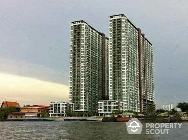 Stunning riverside high-rise building with modern architecture and panoramic views.