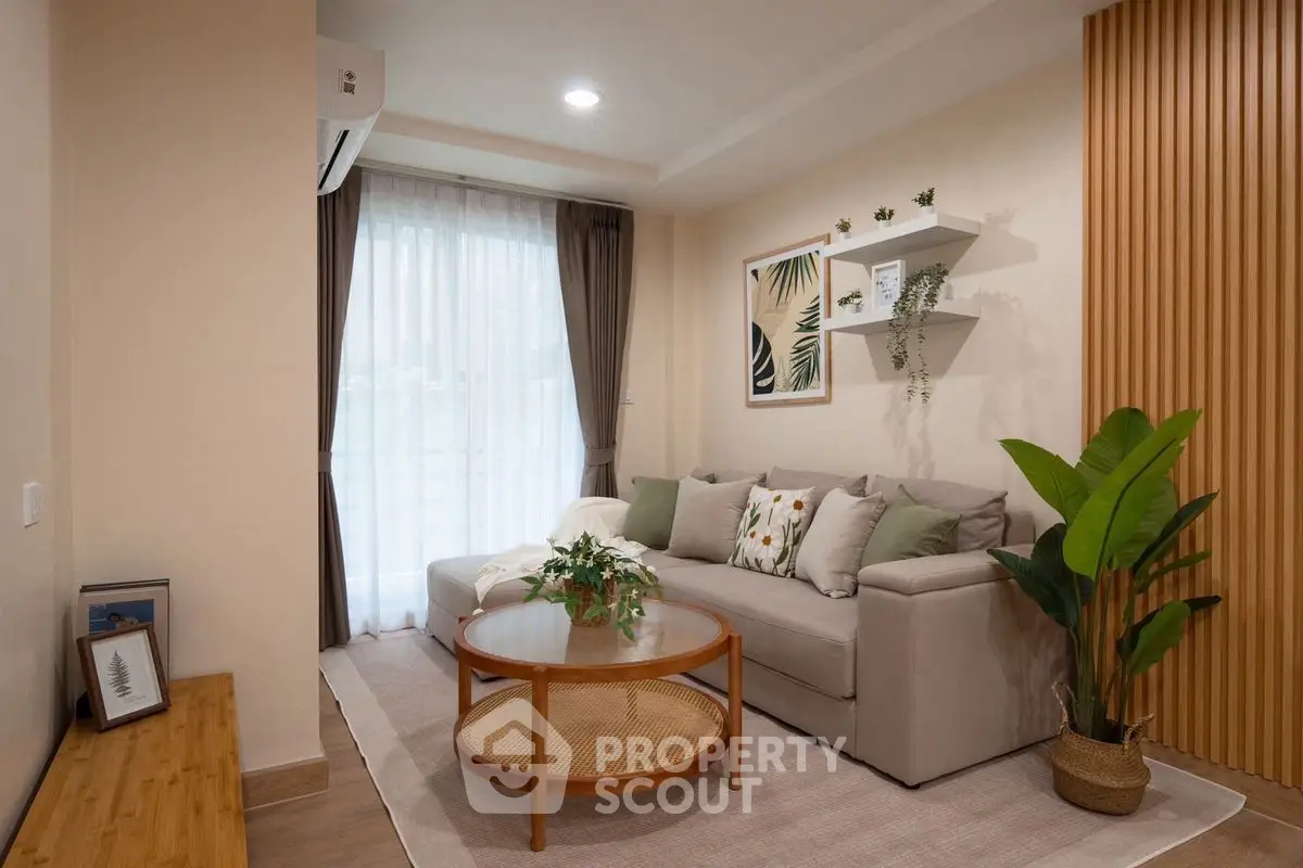 Stylish living room with modern decor, cozy sofa, and elegant wooden accents.