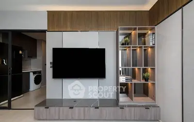 Modern living room with sleek TV setup and stylish shelving unit