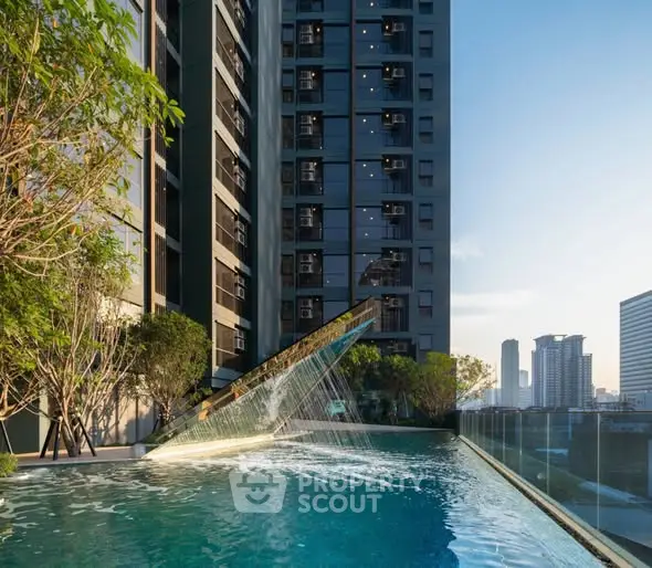 Luxurious rooftop pool with stunning cityscape views in modern high-rise building.