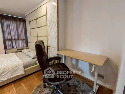 Modern bedroom with stylish decor and ergonomic office chair, perfect for work-from-home setup.