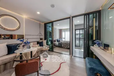 Luxurious modern living room with elegant decor and open view to bedroom