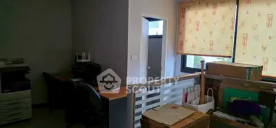 Cozy home office with natural light and organized workspace, ideal for productivity.