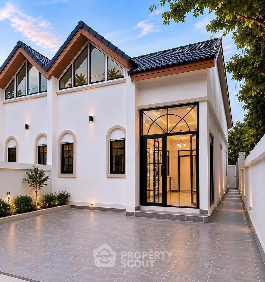 Stunning modern home exterior with elegant design and spacious driveway, perfect for luxury living.