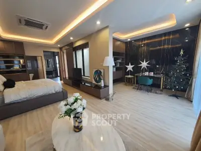 Luxurious open-plan living room with modern decor and elegant lighting