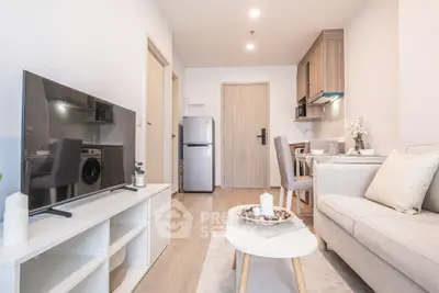 Modern living room with sleek furniture and open kitchen layout, perfect for contemporary living.