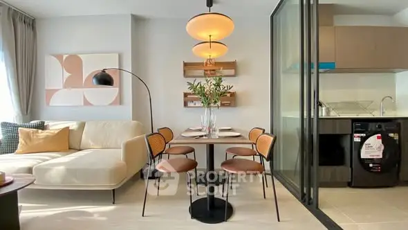 Modern open-plan living and dining area with stylish decor and natural light.