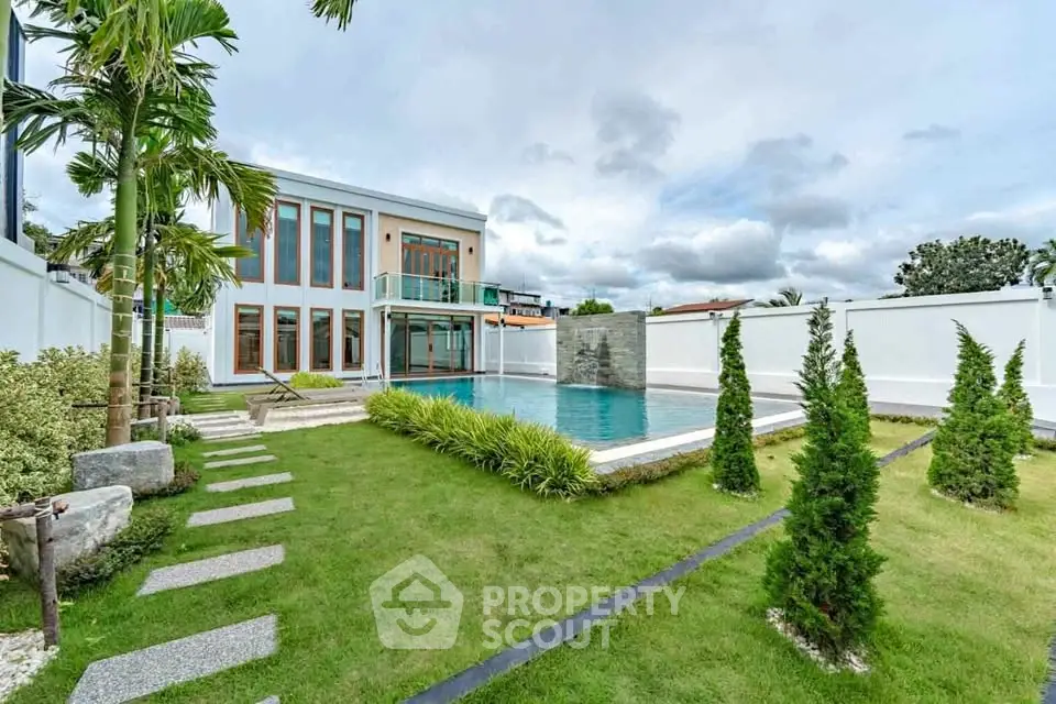 Luxurious modern villa with private pool and landscaped garden, perfect for serene living.