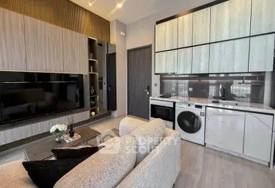 Modern living room with integrated kitchen, featuring sleek cabinetry and built-in appliances.