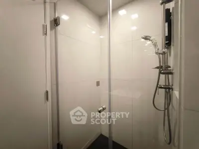 Modern bathroom with sleek shower enclosure and contemporary fixtures
