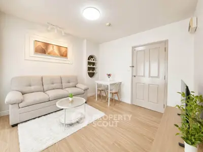 Bright and cozy living room with modern decor and wooden flooring