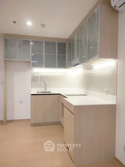 Modern kitchen with sleek cabinetry and under-cabinet lighting