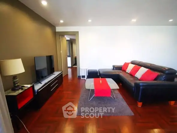 Spacious living room with modern decor and hardwood floors