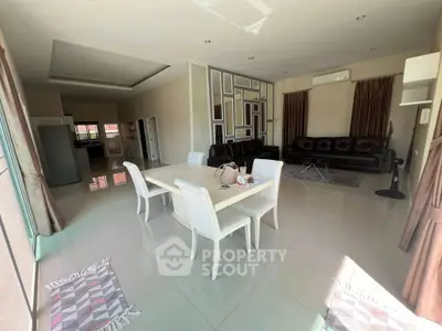 Spacious modern living room with elegant dining area and stylish decor