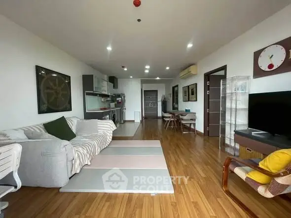 Spacious modern living room with open kitchen and stylish decor