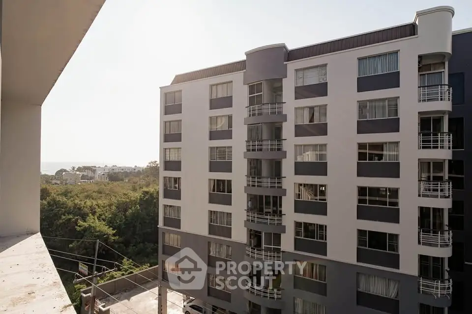 Modern apartment building with sleek design and large windows