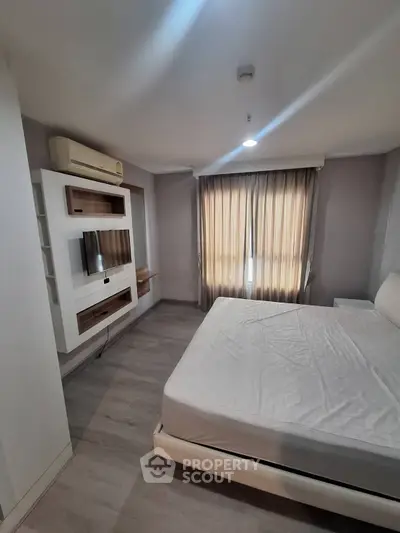 Modern bedroom with stylish built-in furniture and natural light