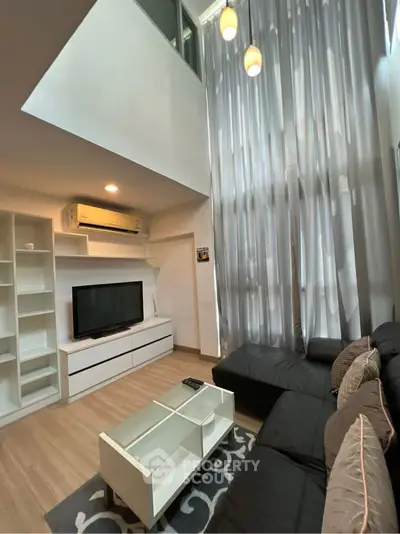 Modern living room with high ceilings and stylish decor