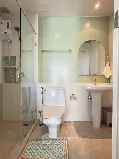 Modern bathroom with glass shower and sleek fixtures