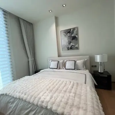 Luxurious modern bedroom with elegant decor and cozy bedding