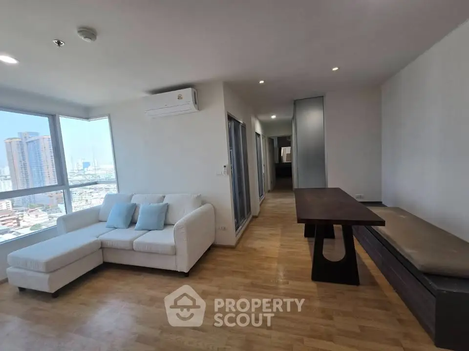 Spacious modern living room with city view and stylish furniture