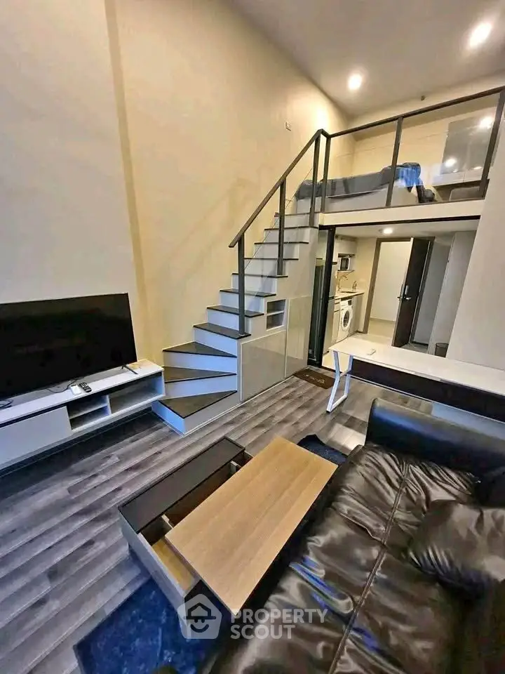 Modern loft apartment with sleek staircase and stylish living area