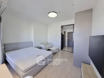 Spacious modern bedroom with minimalist decor and natural light