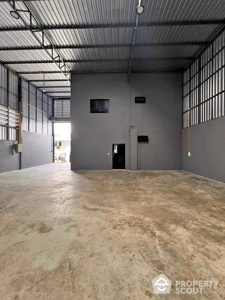 Spacious industrial warehouse with high ceilings and ample natural light