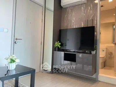 Modern living room with sleek TV setup and stylish decor
