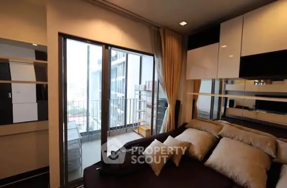 Modern bedroom with balcony access and stylish decor in urban apartment