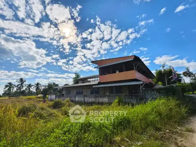 Charming rural property with lush greenery and expansive sky views, perfect for serene living.